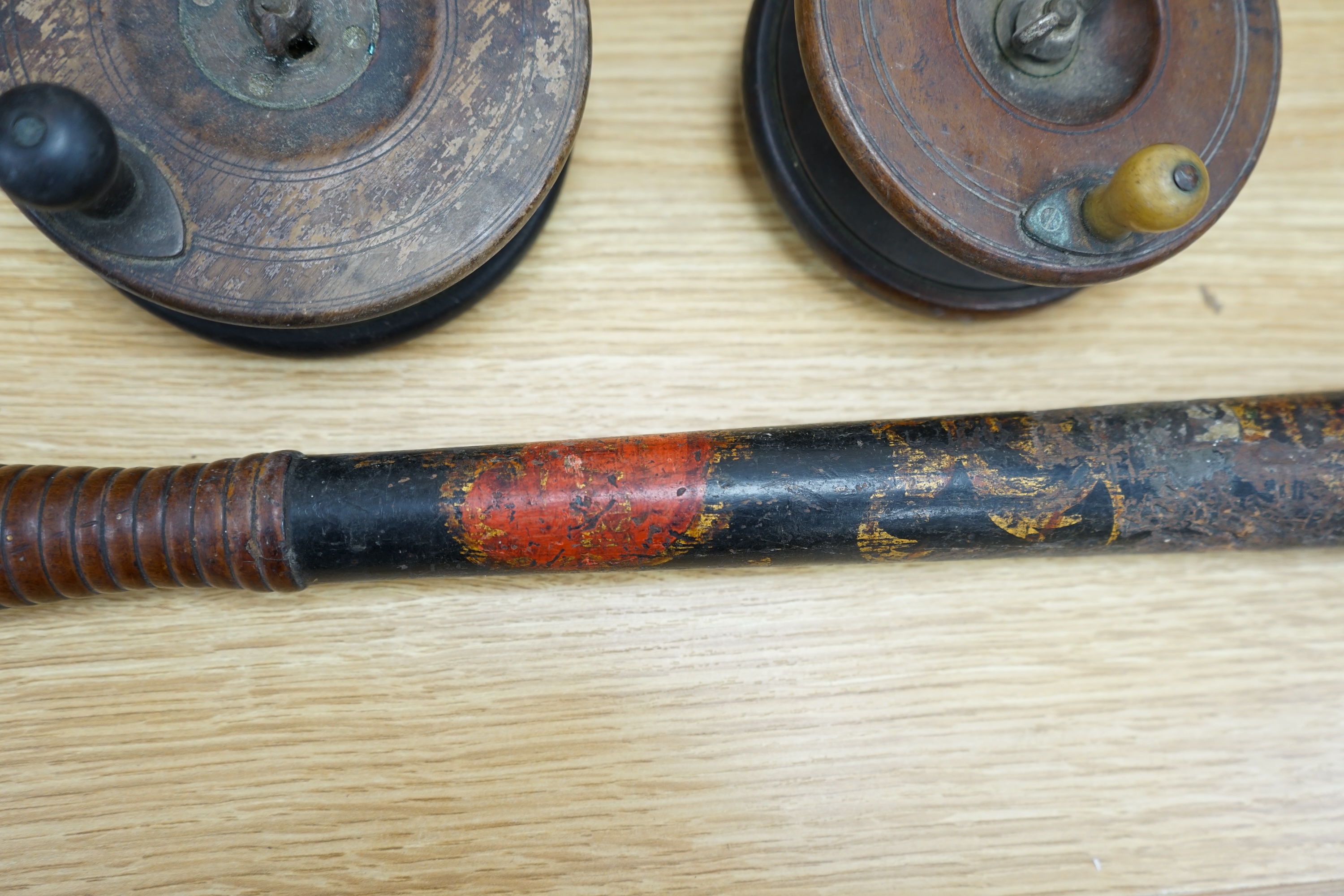 Two wooden fishing reels, a Victorian truncheon and an Arts and Crafts pewter box with enamel roundel. Truncheon 43cm long., Condition - all items worn